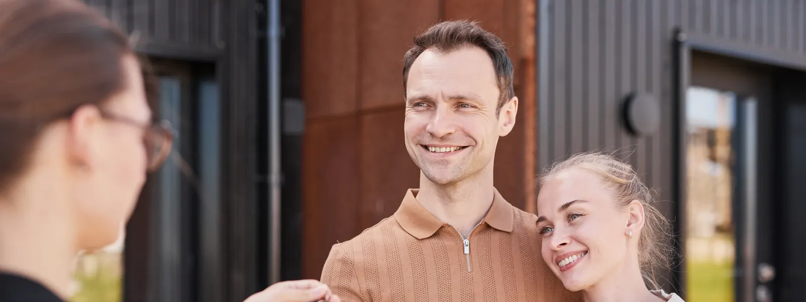 New homeowners receiving the keys to their home
