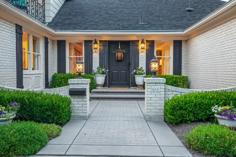 Homeowners at the entrance of their home, ready to sell